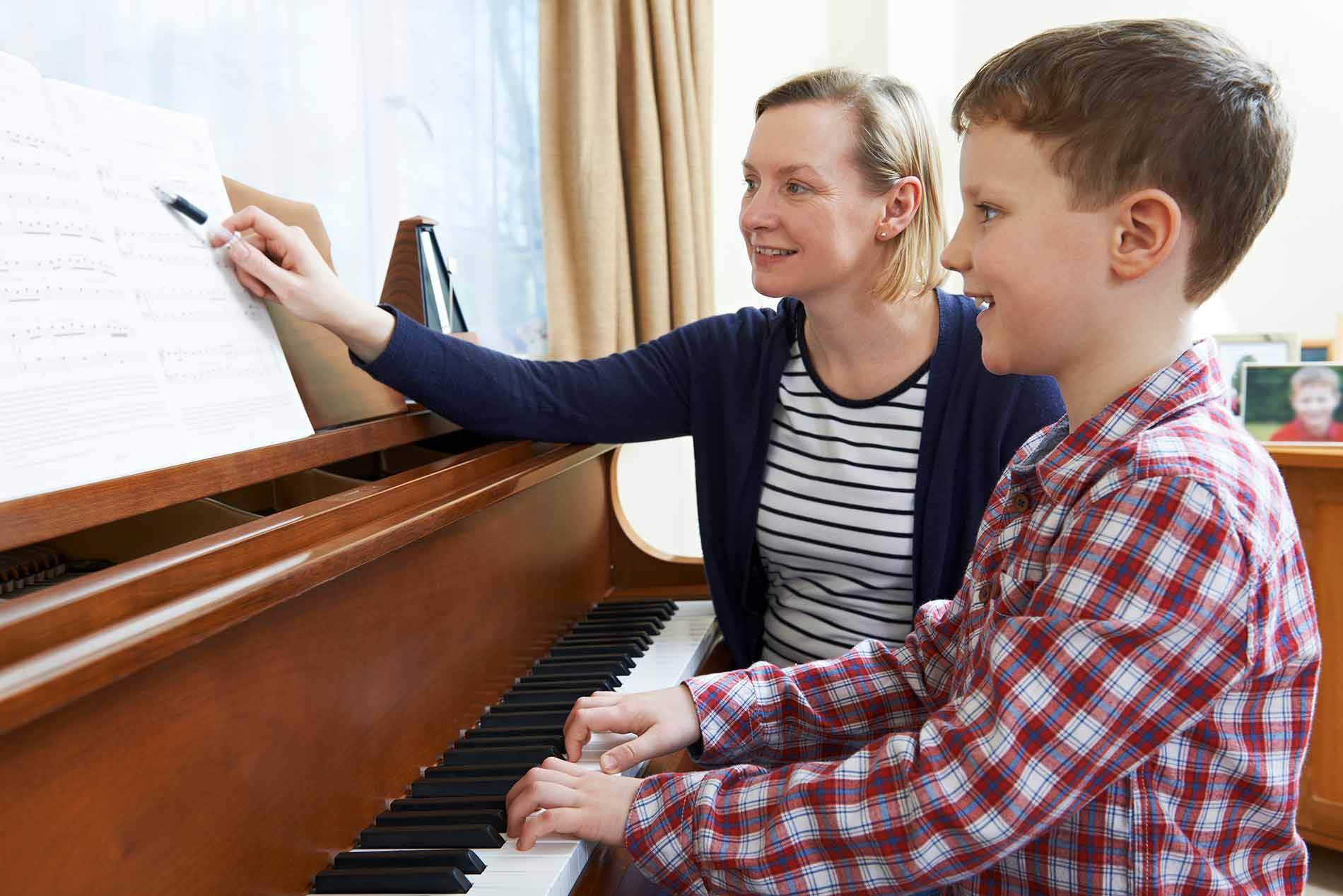 Piano teacher and student